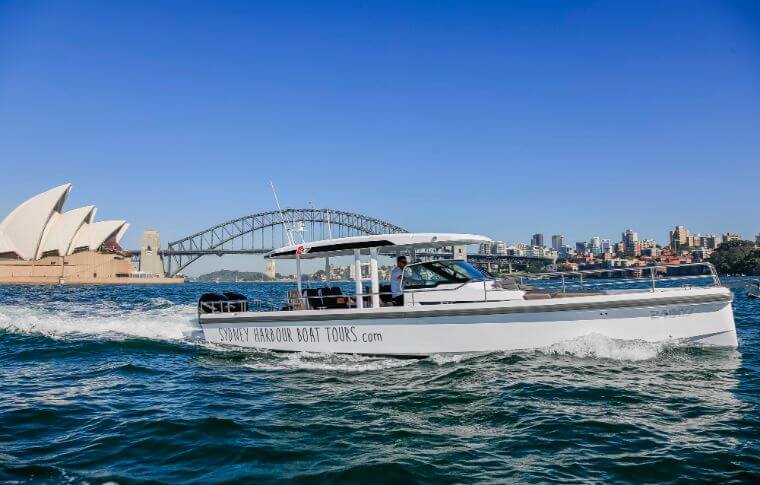 The boat cruises past the Sydney Harbour Bridge.